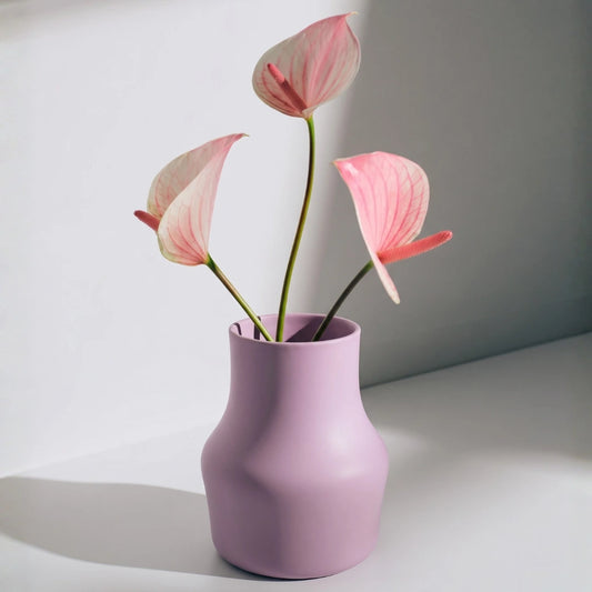 Dorotea Ceramic Lilac vase with pink flowers on a light gray background