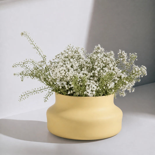Dorotea Ceramic Yellow vase with white flowers on a light background